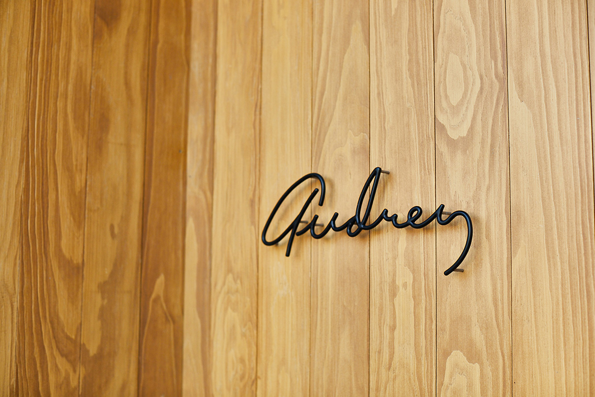 Audrey Restaurant logo on wall